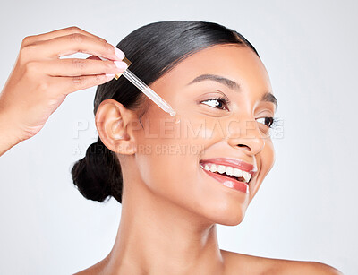 Buy stock photo Happy, woman and pipette with skincare, oil and serum for beauty with wellness on white studio background. Person, cosmetic product or model with hyaluronic acid, luxury or shine with serum and glow
