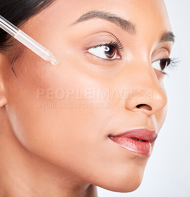 Buy stock photo Face, woman and pipette with skincare, serum and dermatology with wellness on white studio background. Person, cosmetic product or model with hyaluronic acid, aesthetic or shine with oil and beauty