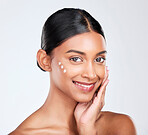Portrait, cream and woman with skincare, beauty and dermatology on a white studio background. Face, person and model with lotion, shine and glow with cosmetics, moisturiser and smile with aesthetic