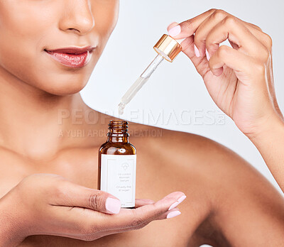 Buy stock photo Oil serum in hands, woman and beauty with natural cosmetic product for skincare isolated on white background. Wellness, hyaluronic acid and liquid collagen for skin glow, pipette and bottle in studio
