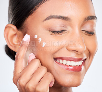 Buy stock photo Cream, skincare and woman with dermatology, smile and wellness on a white studio background. Person, happy girl and model with creme, moisturiser and healthy skin with beauty, aesthetic and self care