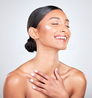 Buy stock photo Smile, cream and woman with cosmetics, beauty and wellness on a white studio background. Person, happy or model with creme, moisturiser or aesthetic with self care, lotion or aesthetic with skincare