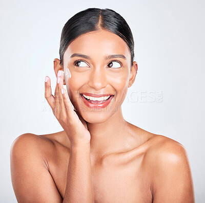 Buy stock photo Woman, excited with cream on face and beauty, moisturizer and skincare isolated on white background. Cosmetics product, lotion or sunscreen with smile, facial and skin glow with dermatology in studio