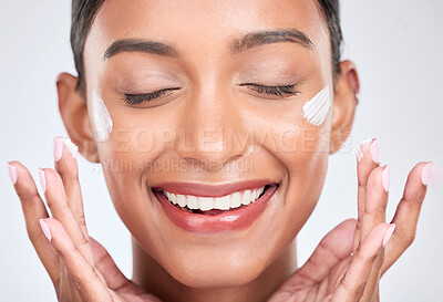 Buy stock photo Happy, cream and woman with beauty, cosmetics or dermatology on a white studio background. Person, creme or model with moisturiser or wellness with self care, lotion or aesthetic with shine and glow