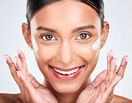 Portrait, cream and woman with dermatology, beauty and cosmetics on a white studio background. Face, person and model with lotion, shine and glow with moisturiser, creme and skincare with aesthetic