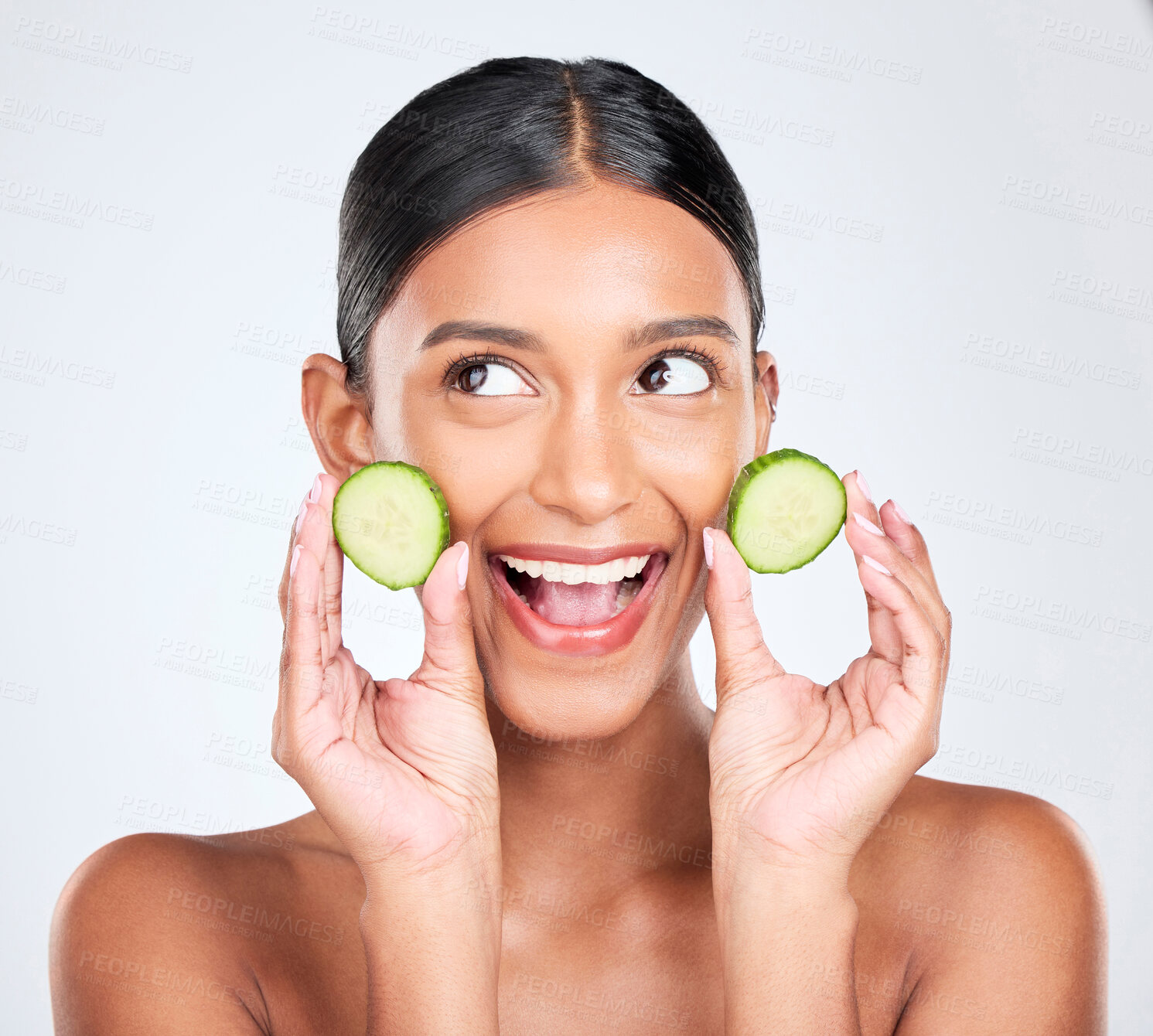 Buy stock photo Face, excited and woman with cucumber, beauty and facial with natural skincare isolated on white background. Wellness, vegetable and vegan cosmetics product with glow, shine and green in studio