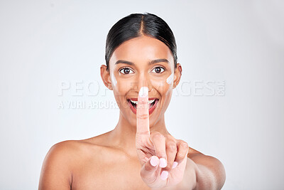 Buy stock photo Beauty, skincare and portrait of woman with face cream in a studio for natural, cosmetic and health routine. Happy, wellness and young female model with spf, sunscreen or lotion by a gray background.