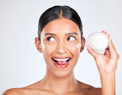 Buy stock photo Woman, happy surprise with cream on face and beauty, moisturizer and skincare with container on white background. Cosmetics product, lotion or sunscreen, facial and skin with dermatology in studio