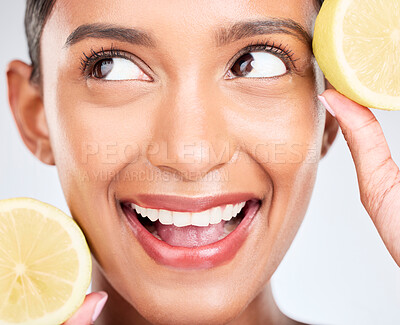 Buy stock photo Lemon, fruit and face of Indian woman with skincare, beauty and benefits of vitamin c in eco friendly cosmetics in studio. Indian, model and thinking of dermatology with healthy and natural fruits