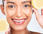 Lemon, fruit and portrait of Indian woman with skincare, beauty and benefits of vitamin c in eco friendly cosmetics in studio. Skin, care and face of model with natural dermatology and healthy fruits