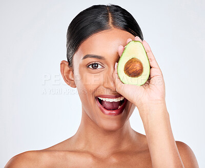 Buy stock photo Avocado, portrait and natural skincare of woman in studio for vitamin c benefits, eco cosmetics and nutrition. Face of happy indian model, healthy food and beauty for omega 3 diet on white background