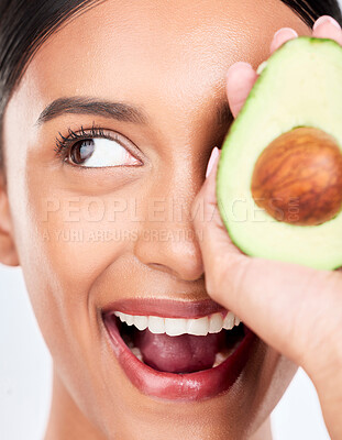 Buy stock photo Closeup, avocado and happy woman with natural beauty, face and eco friendly skincare on white background. Wellness, dermatology and vegan cosmetics product with glow, facial and green in a studio