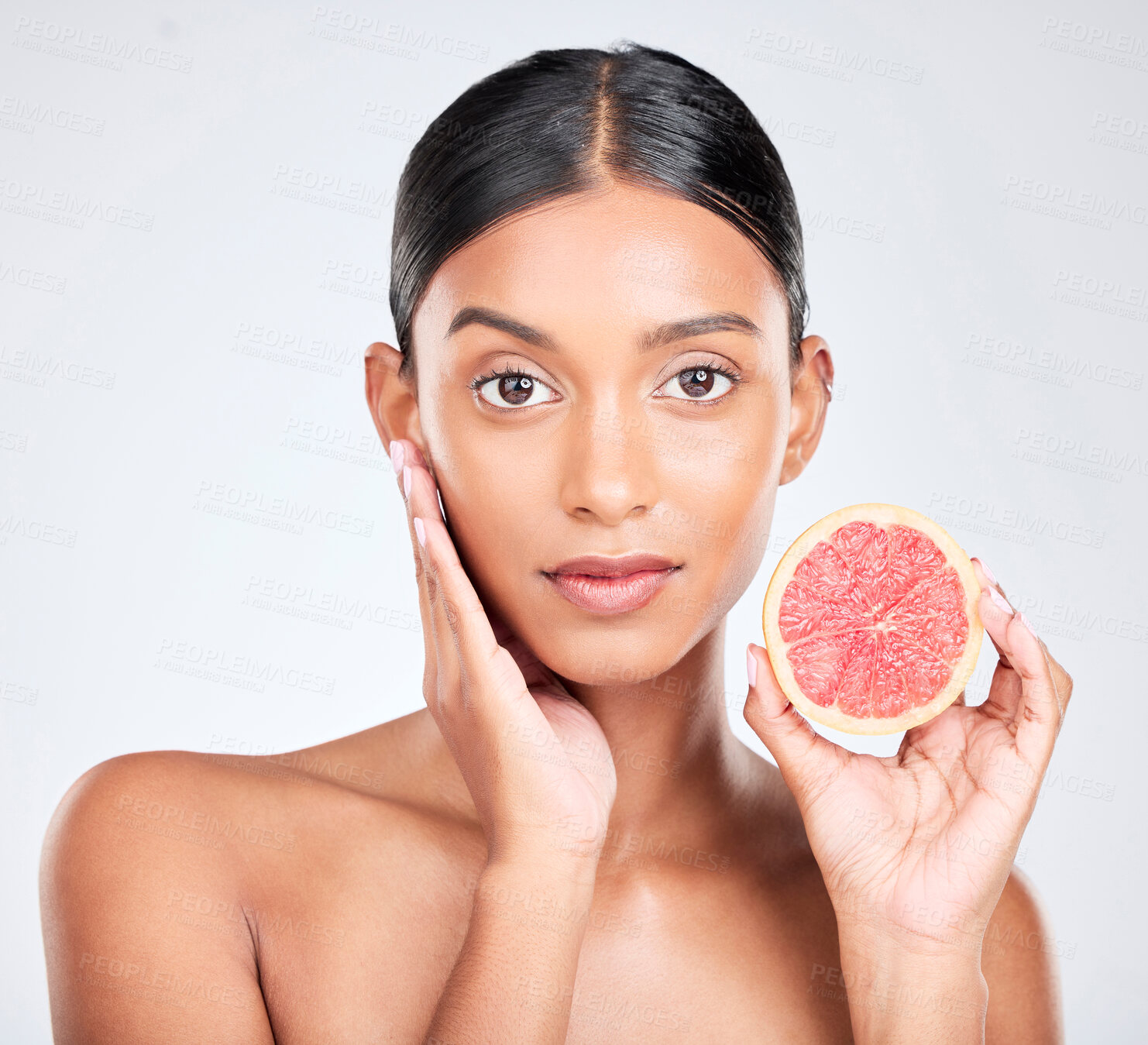 Buy stock photo Face, woman with grapefruit and natural beauty, facial and eco friendly skincare portrait on white background. Wellness, fruit and vegan cosmetic product with glow, vitamin c and citrus in studio