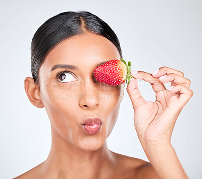Buy stock photo Kiss face, strawberry and woman with beauty, nutrition and health with shine isolated on white background. Fruit, vegan and wellness with eco friendly skincare, natural cosmetics and pout in studio 