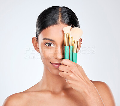 Buy stock photo Woman, portrait and brush for makeup, beauty and tools with cosmetology isolated on white background. Wellness, face and skin with shine, foundation or powder with cosmetics and glamour in studio