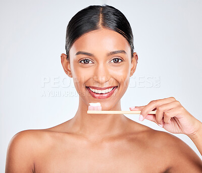 Buy stock photo Toothbrush, toothpaste and dental with woman in portrait, health and fresh breath isolated on white background. Bamboo, face and teeth whitening with oral care, orthodontics and routine in studio