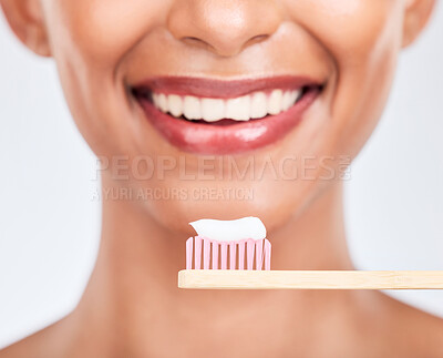 Buy stock photo Toothbrush, toothpaste and dental with woman and closeup, health and fresh breath isolated on white background. Bamboo, mouth and teeth whitening with oral care, orthodontics and routine in studio