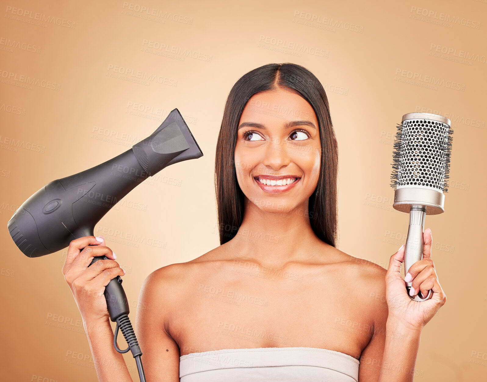 Buy stock photo Hairdryer, brush and young woman in studio with clean salon treatment hairstyle for wellness. Health, hair care and Indian female model with tools for haircut maintenance isolated by brown background