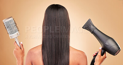 Buy stock photo Hairdryer, brush and back of woman in studio with cosmetic salon treatment hairstyle for wellness. Health, glamour and female model with tools for haircut styling maintenance by brown background.
