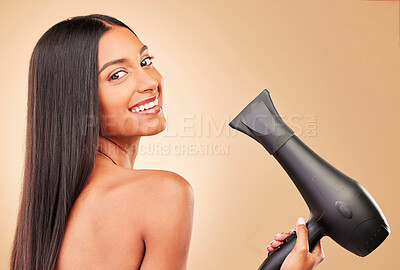 Buy stock photo Hairdryer, smile and portrait of woman in studio with clean salon treatment hairstyle for wellness. Health, wellness and happy female model with cosmetic tool for maintenance by a brown background.