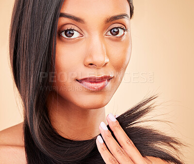 Buy stock photo Hair care, beauty and portrait of woman in a studio with split ends for salon keratin treatment. Makeup, cosmetic and headshot of Indian female model with hairstyle isolated by a brown background.