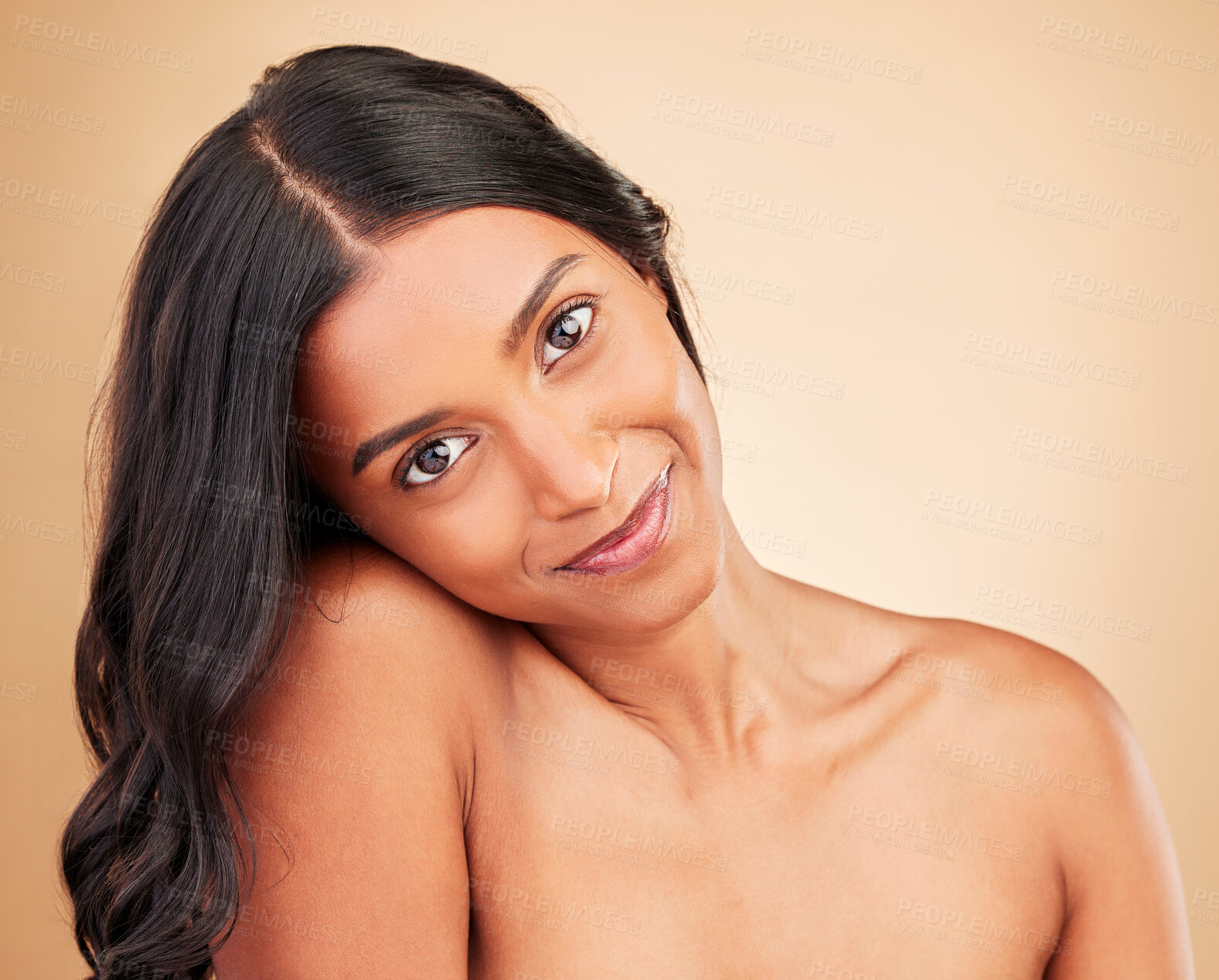 Buy stock photo Curly hair, beauty and face of happy woman in studio isolated on a brown background. Hairstyle care, natural cosmetics and portrait of Indian model in salon treatment for health, wellness and skin