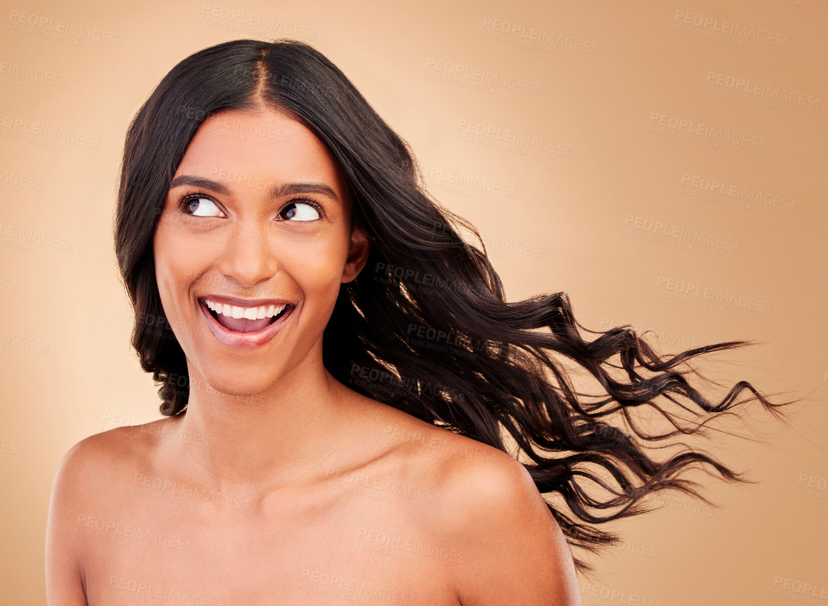 Buy stock photo Thinking, hair care and happy woman with wind growth or beauty isolated in a studio brown background with strong texture. Aesthetic, natural and young person with cosmetics for health and shine