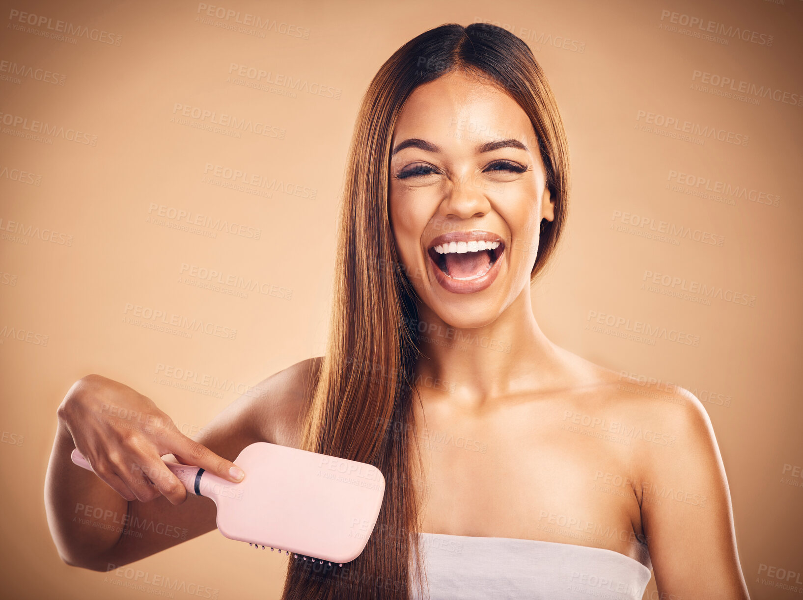 Buy stock photo Hair care, brush and portrait of a woman in studio for beauty, cosmetics or happiness. Excited aesthetic model person on brown background for wellness, healthy growth and hairdresser or salon results