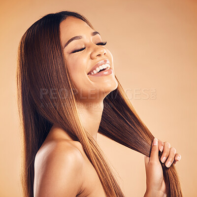 Buy stock photo Smile, beauty and hair with a natural woman in studio on a brown background for keratin treatment. Face, shampoo and conditioner with a happy young model at the salon for growth or aesthetic haircare