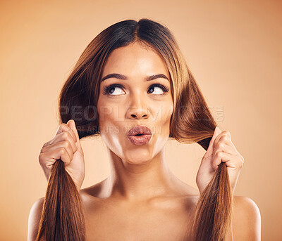 Buy stock photo Face pucker, beauty or woman with hair care, healthy shine and strong extensions, volume or keratin results. Hairdressing, facial expression or natural model with studio hairstyle on brown background