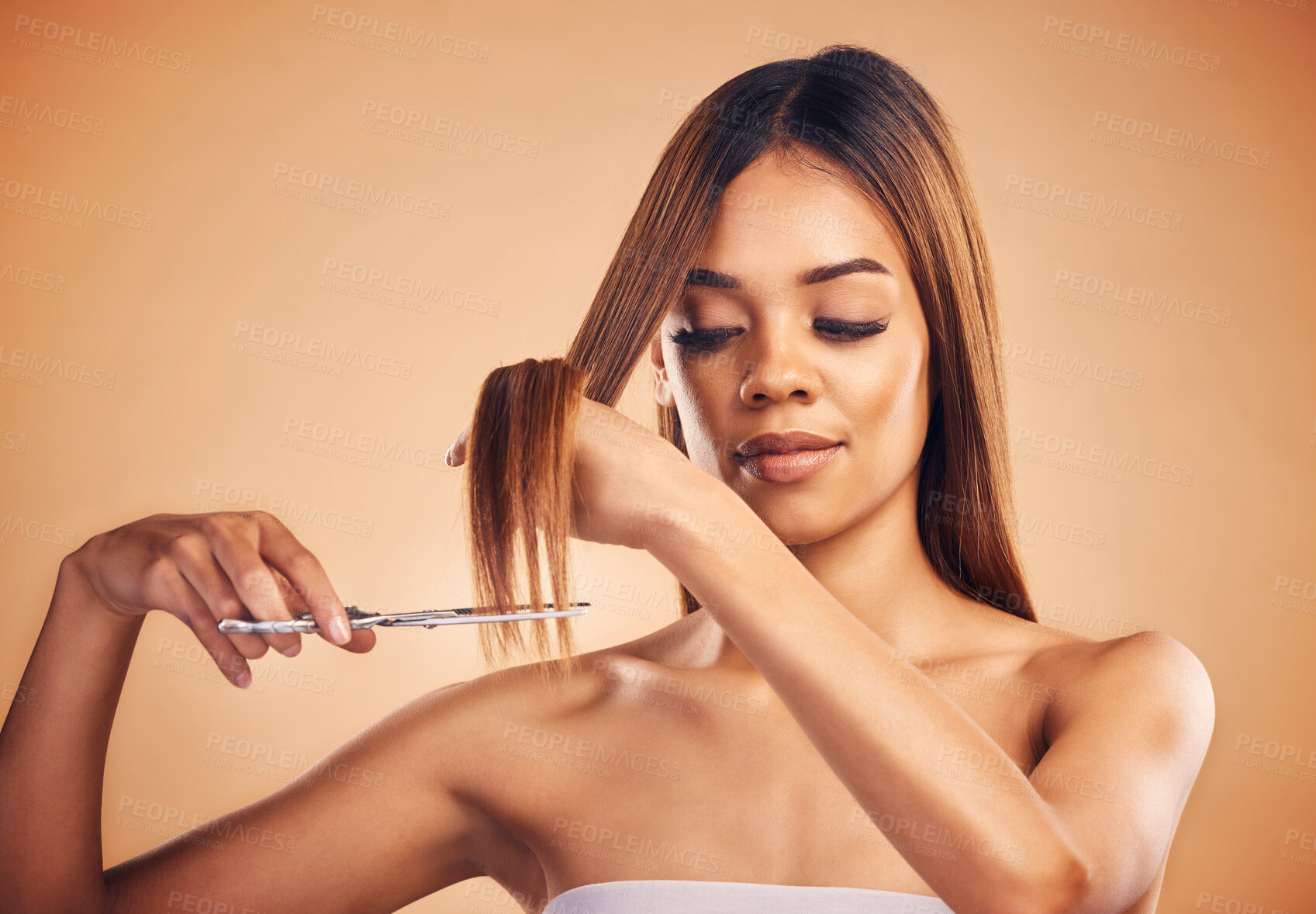 Buy stock photo Scissors, face and woman cut hair, split ends or doing hairstyle growth maintenance, self care routine or grooming treatment. Hairdressing product, beauty studio and model haircut on brown background