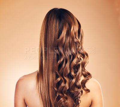 Buy stock photo Back view, hair care and curly woman with beauty and strong texture with growth isolated in a studio brown background. Glow, shine and person with cosmetics aesthetic or natural haircut with shampoo
