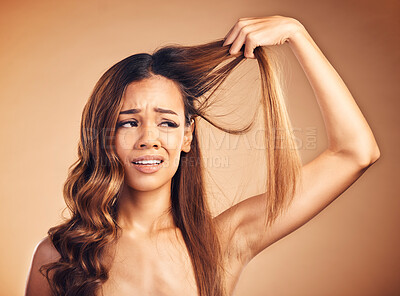 Buy stock photo Hair, problem and sad woman with damage and frustrated from salon treatment and Brazilian fail. Studio, brown background and model with crisis from split ends and upset of bad and messy haircut 