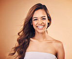 Hair, care and happy woman in portrait with beauty, cosmetics or balayage hairstyle in studio background. Skincare, makeup and laughing with happiness or smile for collagen treatment or dermatology