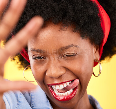 Buy stock photo Portrait, black woman or influencer taking a selfie with a crazy face or tongue out on social media. Fashion, funny wink or cool African girl taking a photo, vlog or picture on studio background