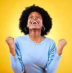 Black woman, excited and fist in studio for success, celebrate freedom or winning lottery bonus on yellow background. Happy model, cheers or celebration of good news, crazy deal or lotto prize winner