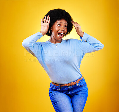 Happy black woman, wow and excited winner in celebration isolated on a yellow background in studio. Smile, surprise and shocked African person in achievement success, bonus promotion and good news.