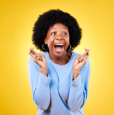 Buy stock photo Woman, fingers crossed and happy surprise in studio for winning announcement, hope or wow for prize deal. Excited african model wish for good news, lucky giveaway winner or shout on yellow background