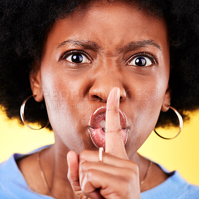 Buy stock photo Angry portrait, woman and secret on lips in studio for privacy, drama and noise on yellow background. Face closeup of annoyed african model warning with finger emoji for whisper, quiet or voice sign