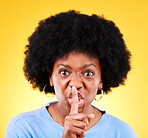 Angry, woman and portrait for noise sign, drama and secret privacy on yellow background in studio. Face, moody african model and warning with finger on lips for whisper, quiet emoji and silence voice