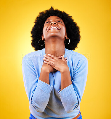 Buy stock photo Happy, excited and a young woman in studio with good news, hope and gratitude. Black person or winner on a yellow background for announcement, hands on chest and grateful for luck or self love