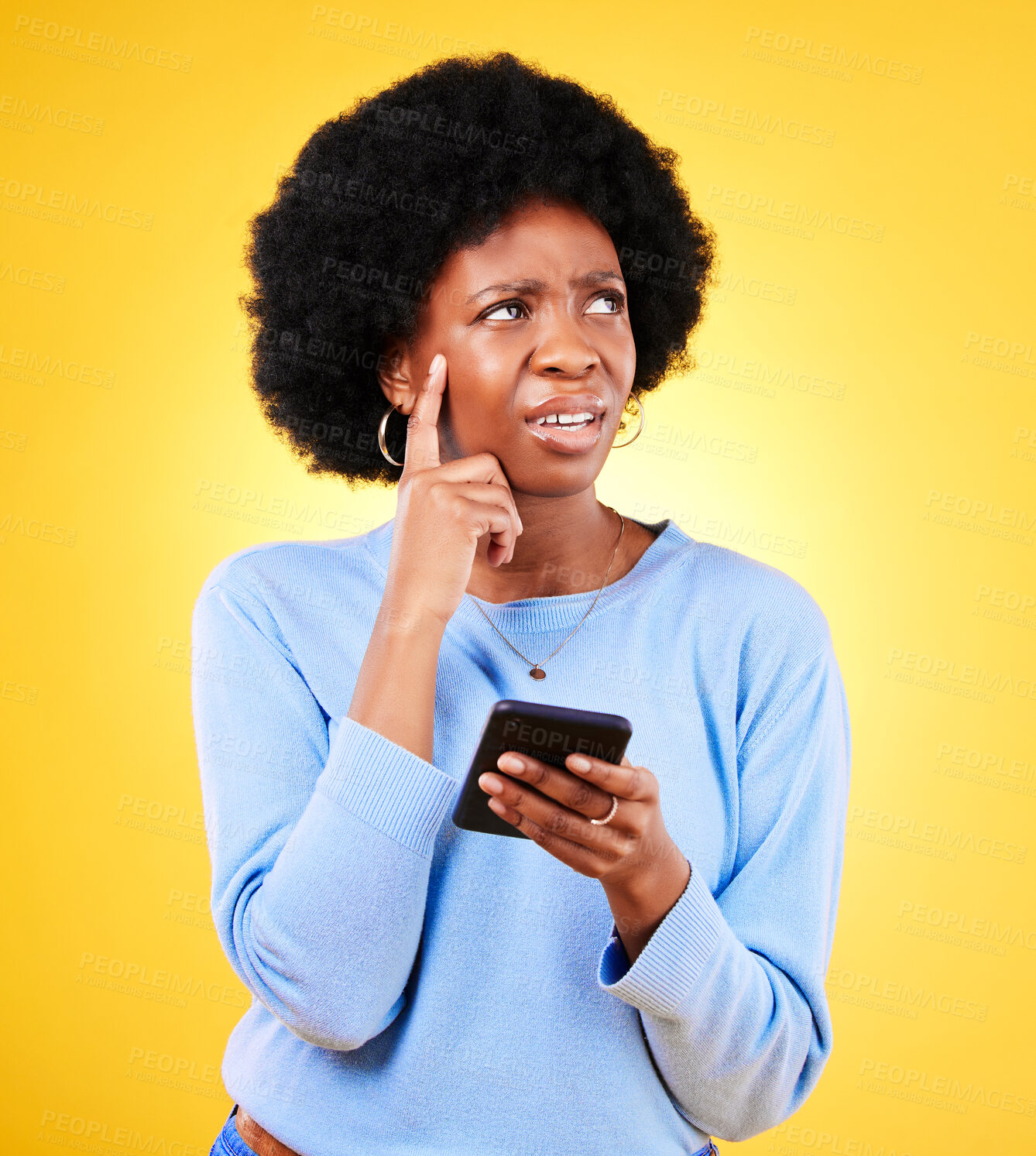 Buy stock photo Confused, thinking and black woman with mobile for a chat, communication or an app. Website, contact and an African girl with doubt about an online message or web notification on a yellow background