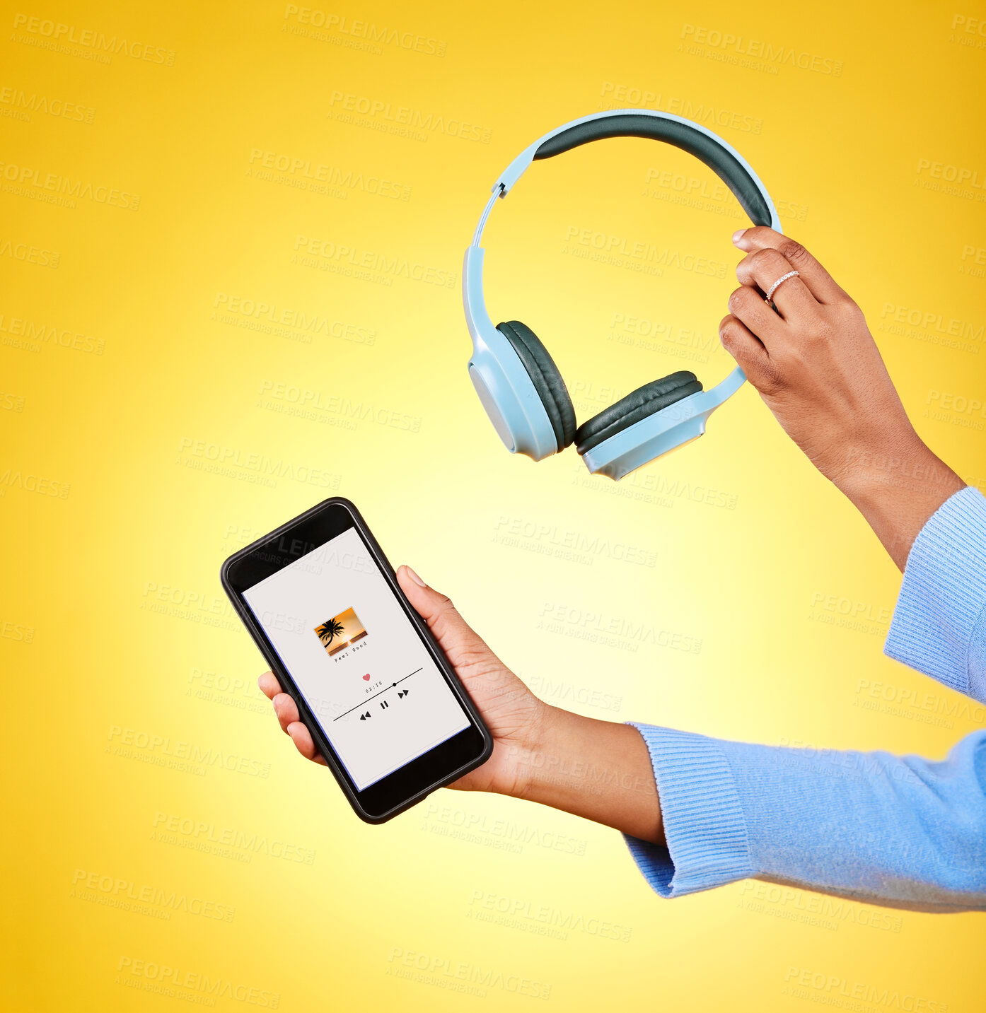 Buy stock photo Music, hands and phone and headphones on app for a streaming service. Audio, technology and person with a mobile app for the radio or listening to a podcast online for UI screen on yellow background