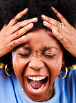 Angry, shouting and face of a frustrated black woman with stress, fail or crazy in studio. Closeup, screaming and an African person or girl with emotion, depression or mental health on a backdrop