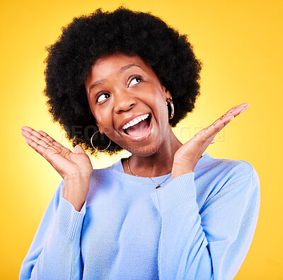 Buy stock photo Surprise, excited and thinking with a woman in studio with good news, mouth open and wow emoji. Face of a black person or winner on a yellow background for announcement, shock and review idea
