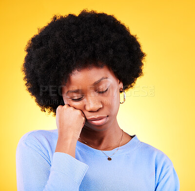 Buy stock photo Tired, black woman and hand on face in studio looking sad, fatigue and burnout of depression and mental health. Exhausted, person and stress with crisis, anxiety and problem on yellow background 
