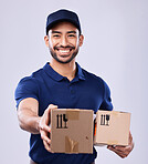 Smile, portrait and delivery man giving boxes in studio, safe transport for ecommerce supplier product. Package, logistics and happy courier person on white background for online sales and services.