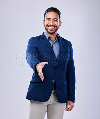 Buy stock photo Smile, handshake and portrait of businessman in a studio for deal, partnership or onboarding. Happy, professional and Indian male lawyer with a shaking hands gesture for greeting by white background.