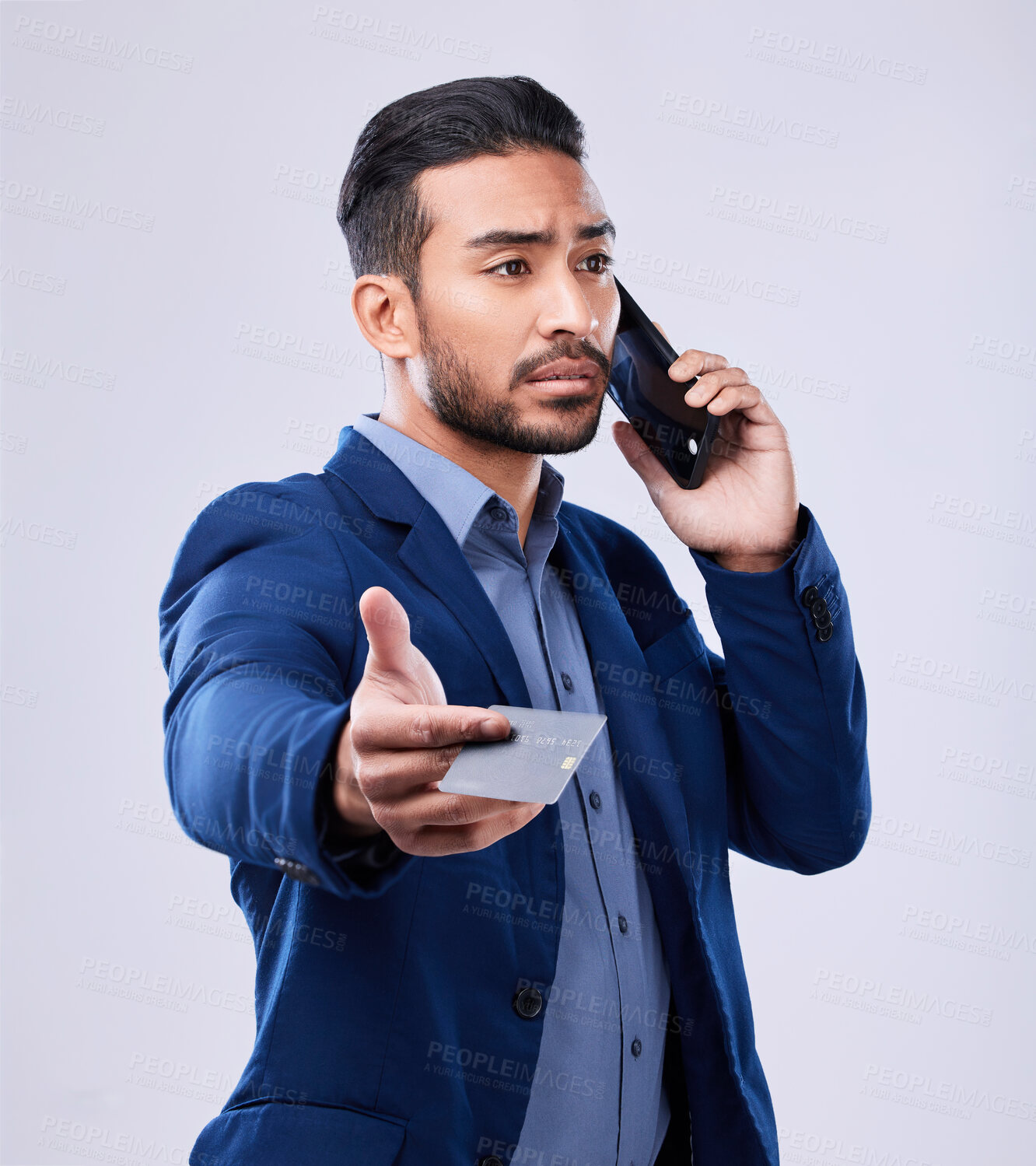 Buy stock photo Credit card, phone call and a business man in studio for communication or fintech payment. Asian person, smartphone and finance for membership subscription, account or banking info on grey background