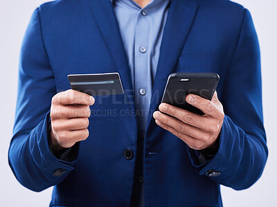 Buy stock photo Closeup, hands and a person with a phone and credit card on a studio background for ecommerce. Website, digital or an online customer doing shopping, banking or payment on an easy mobile app